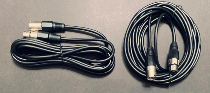 Pair of black XLR cables for audio equipment
