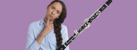 Yamaha YCL-255 clarinet with woman looking confused on purple background